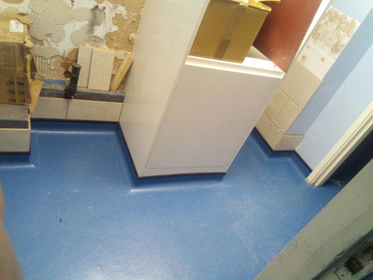 Safety flooring / wet room floor installation.